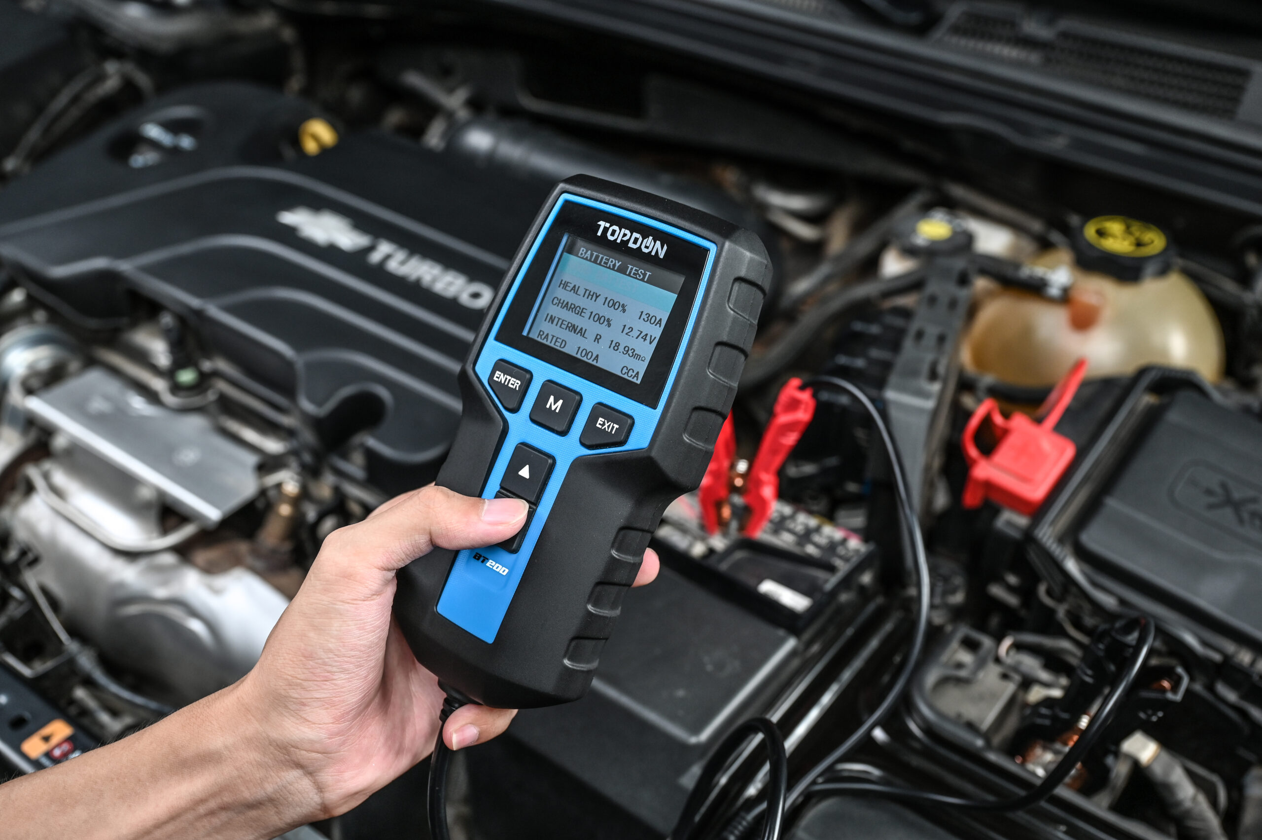 Car battery tester in use with Topdon BT200 device